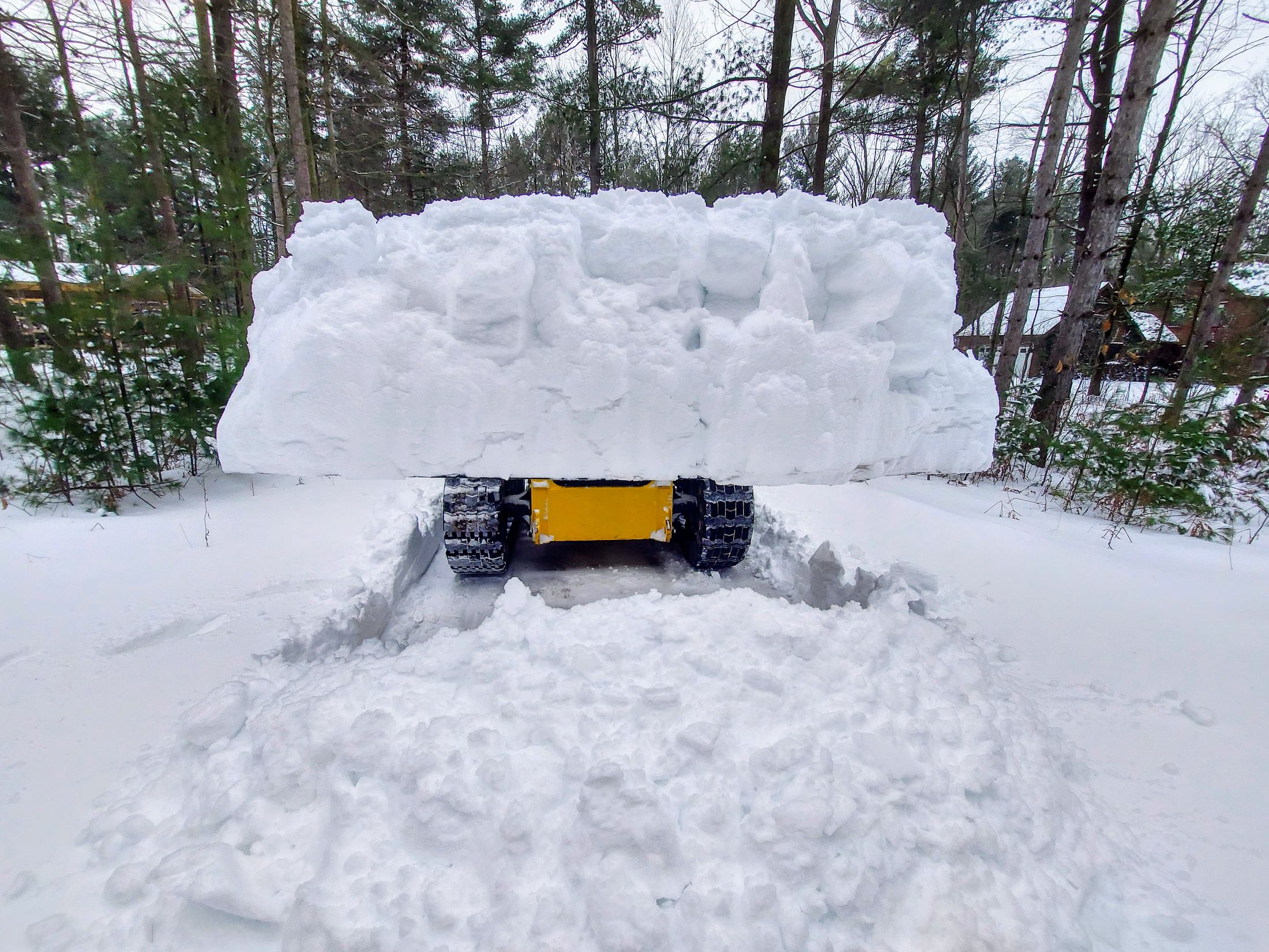 High Volume Material Bucket carrying a wall of snow