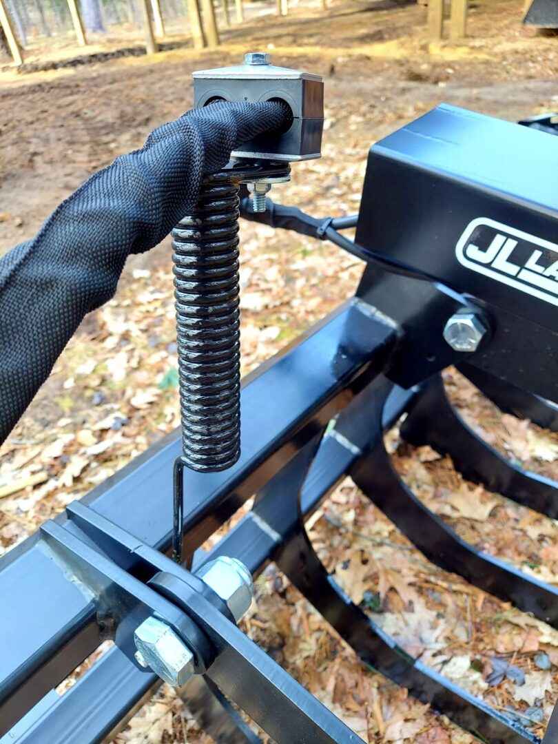 A close up of the fork on a tractor