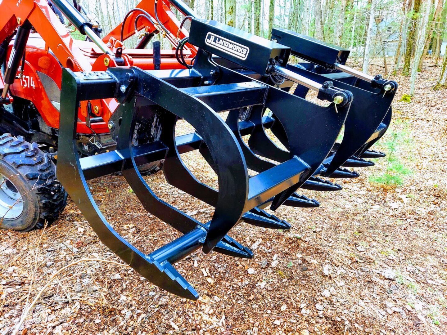 A row of black metal machinery sitting on top of a pile.