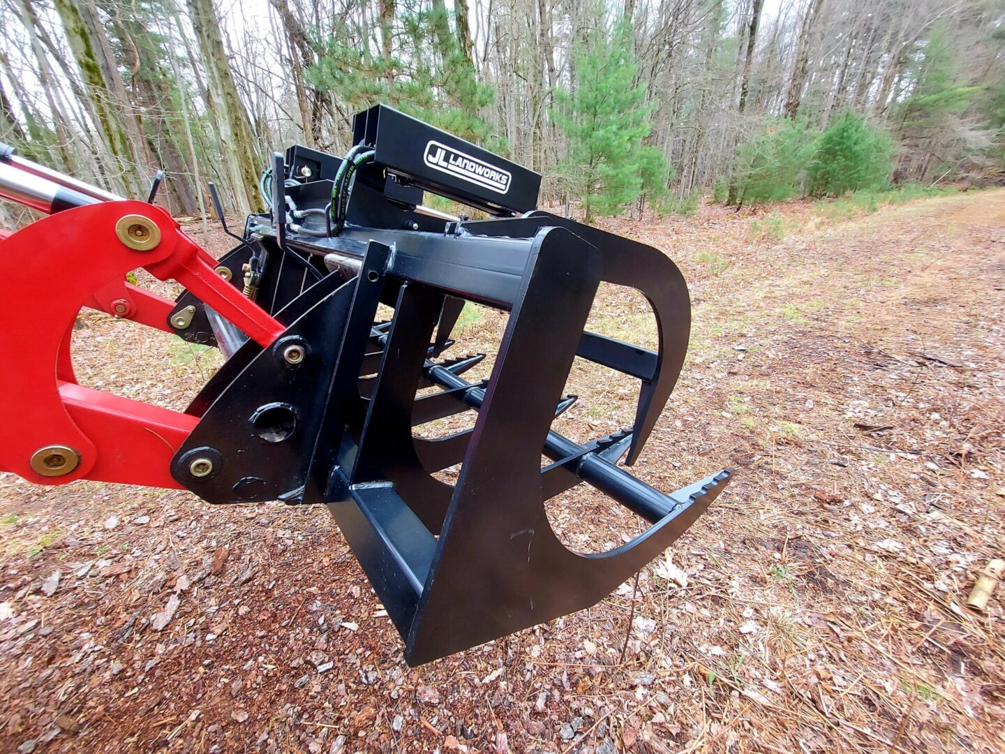 A close up of the back end of a tractor grapple.