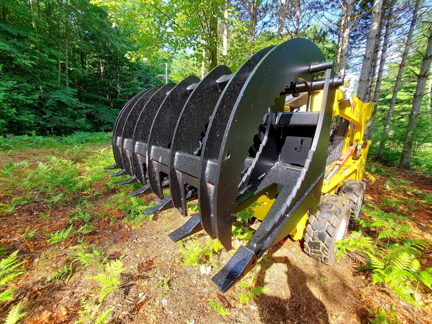 A close up of a yellow and black machine