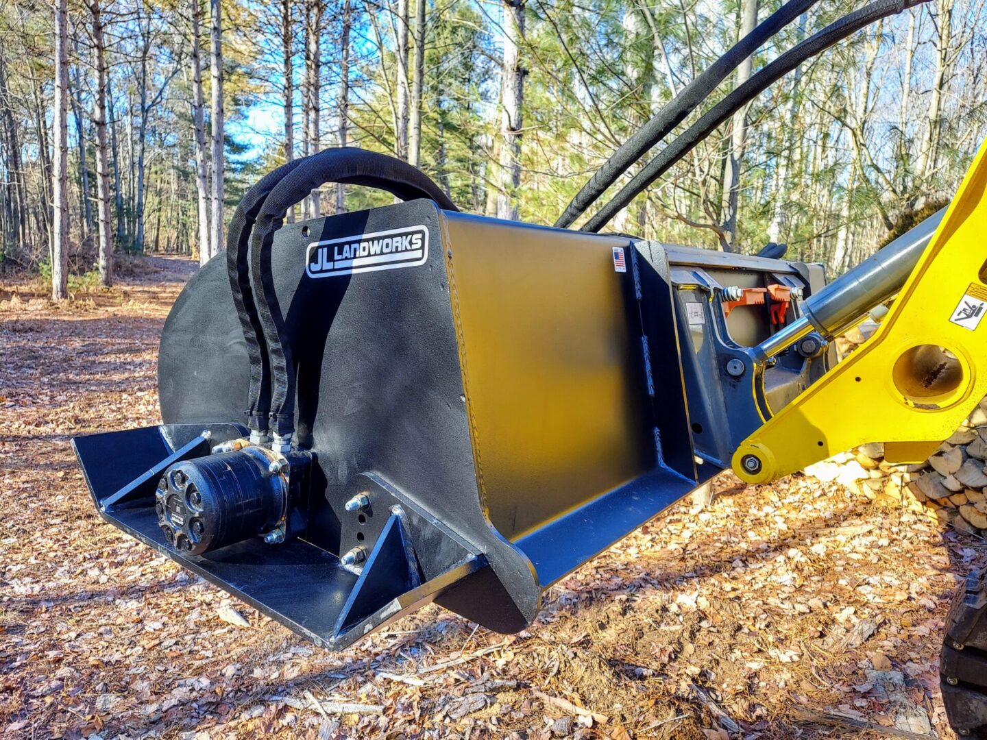 A close up of the front end of a grapple bucket.