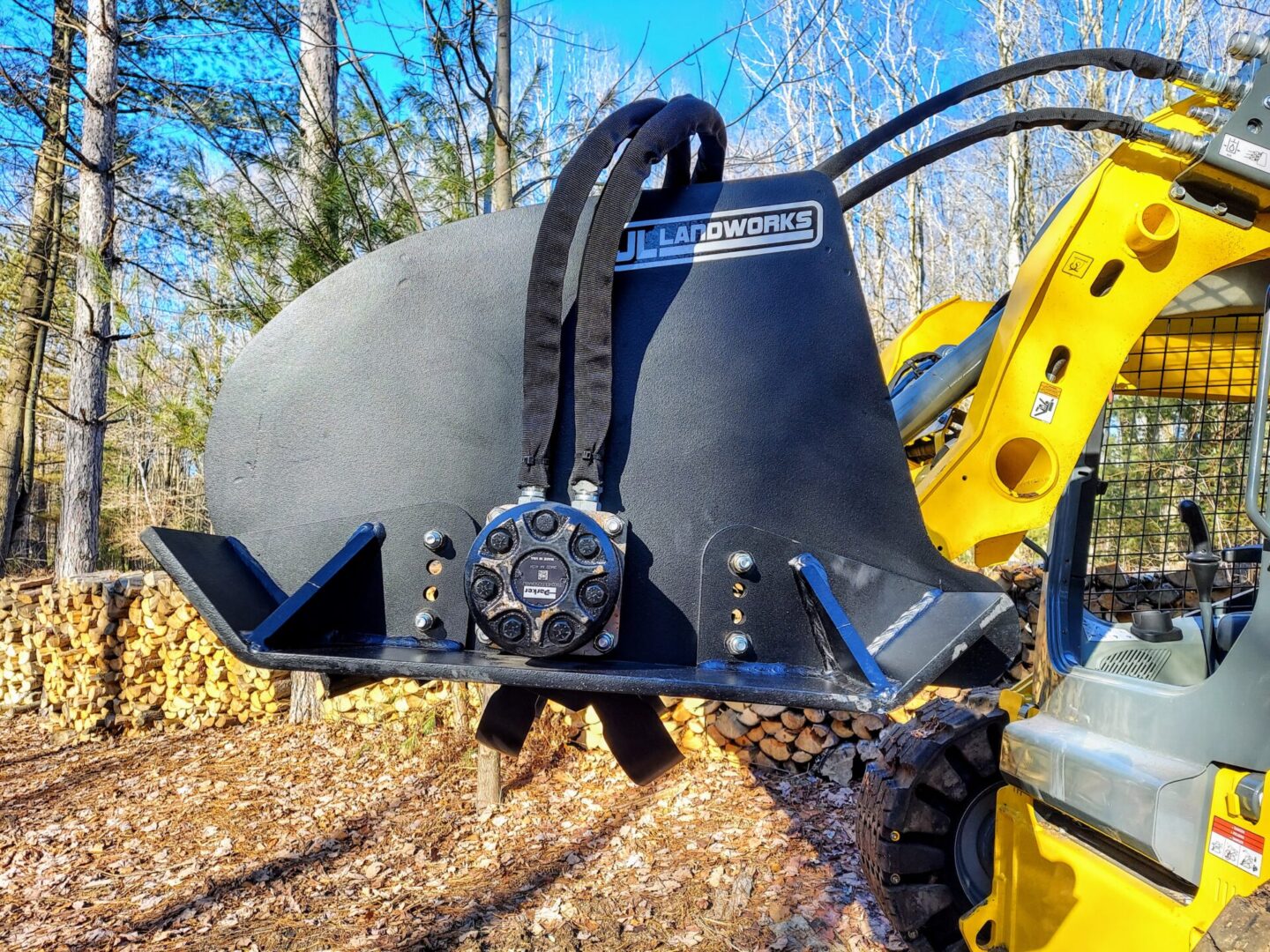 A close up of the back end of a backhoe