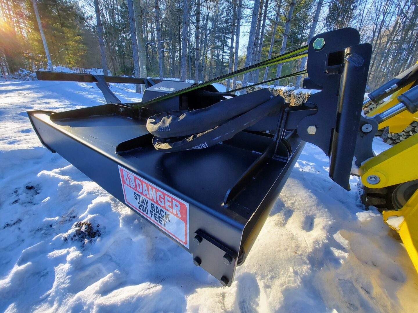 A snow plow is shown in the snow.