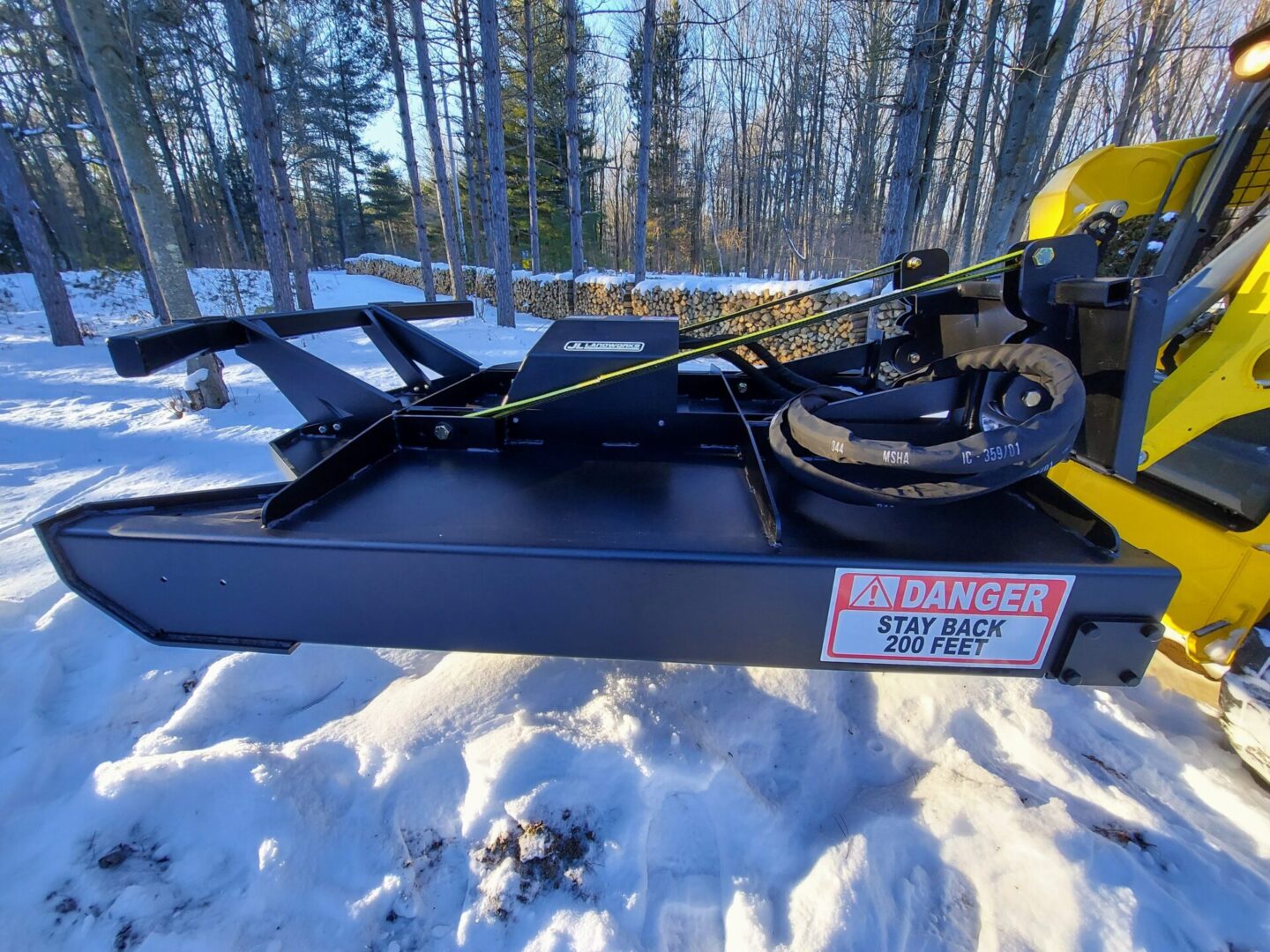 A snow sled with a yellow harness on it