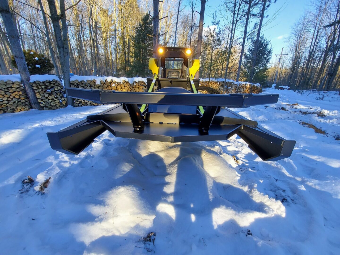 A large truck is parked in the snow.