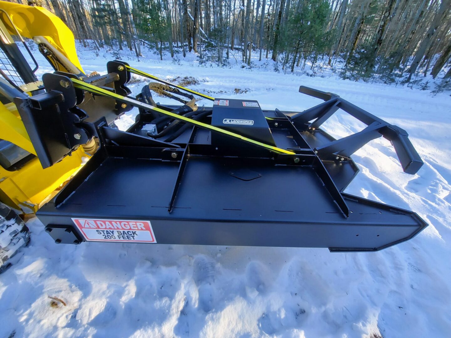 A snow plow is shown in the snow.