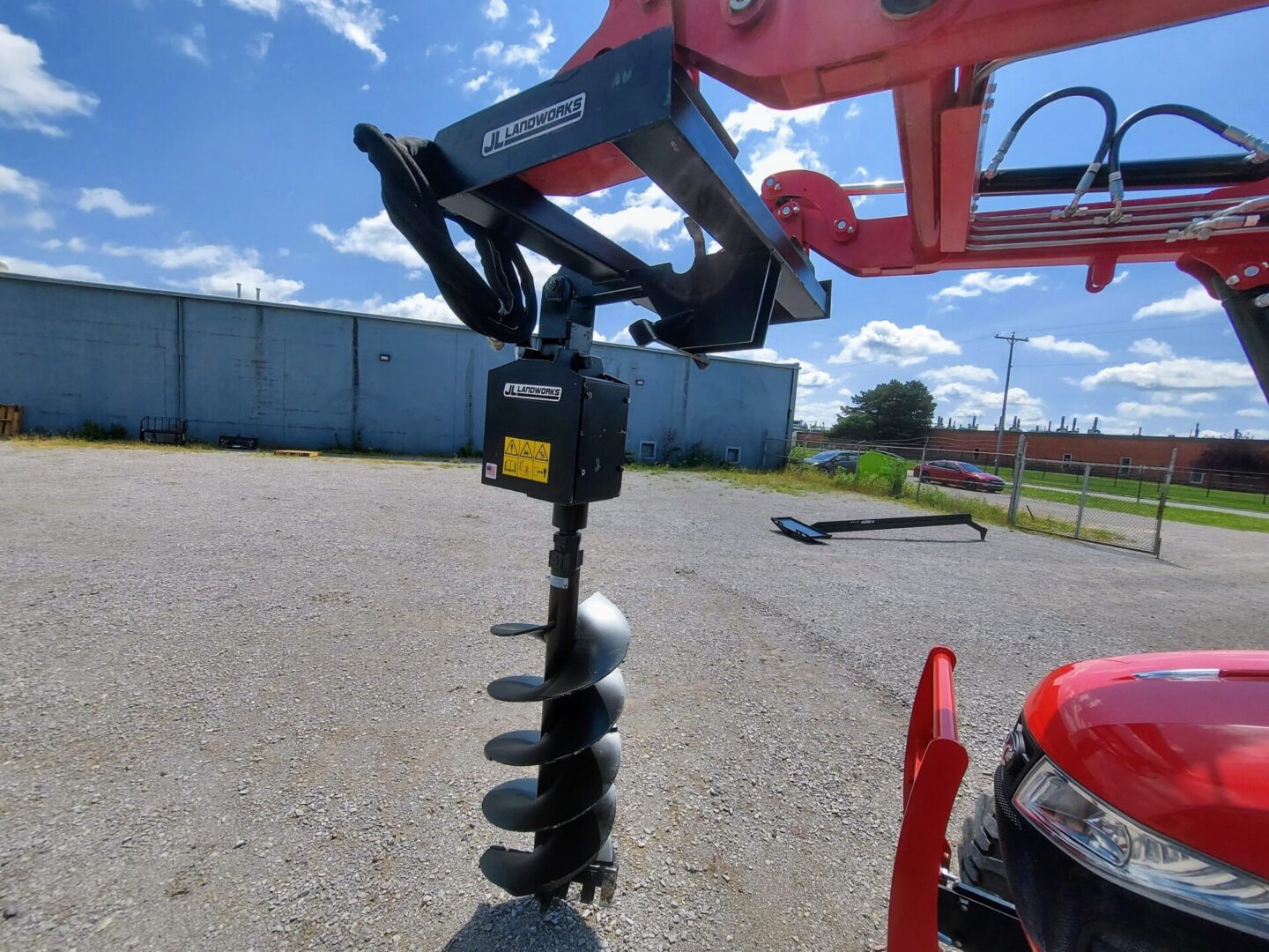 A close up of an auger on the ground