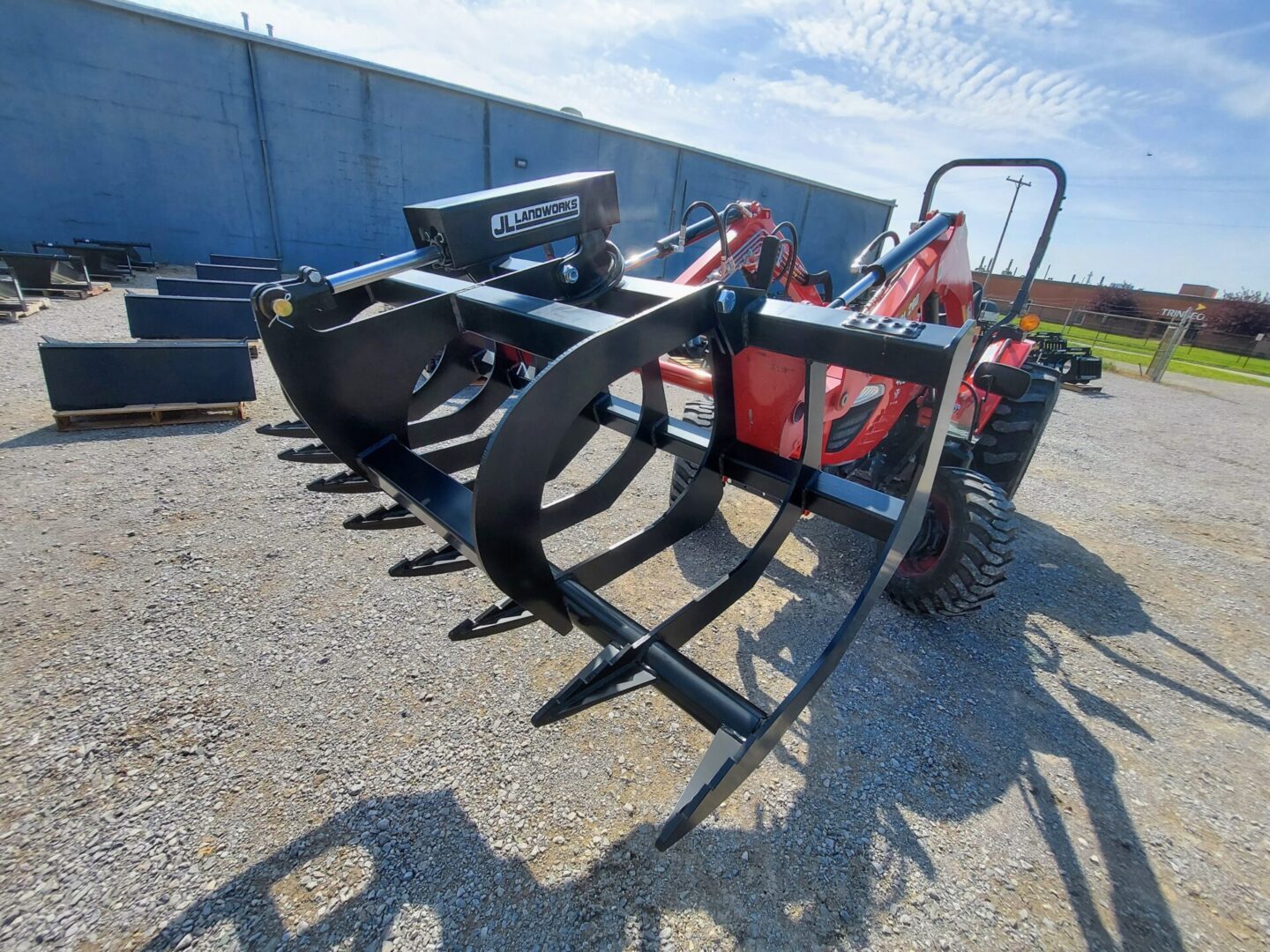 A tractor with a plow attached to it.