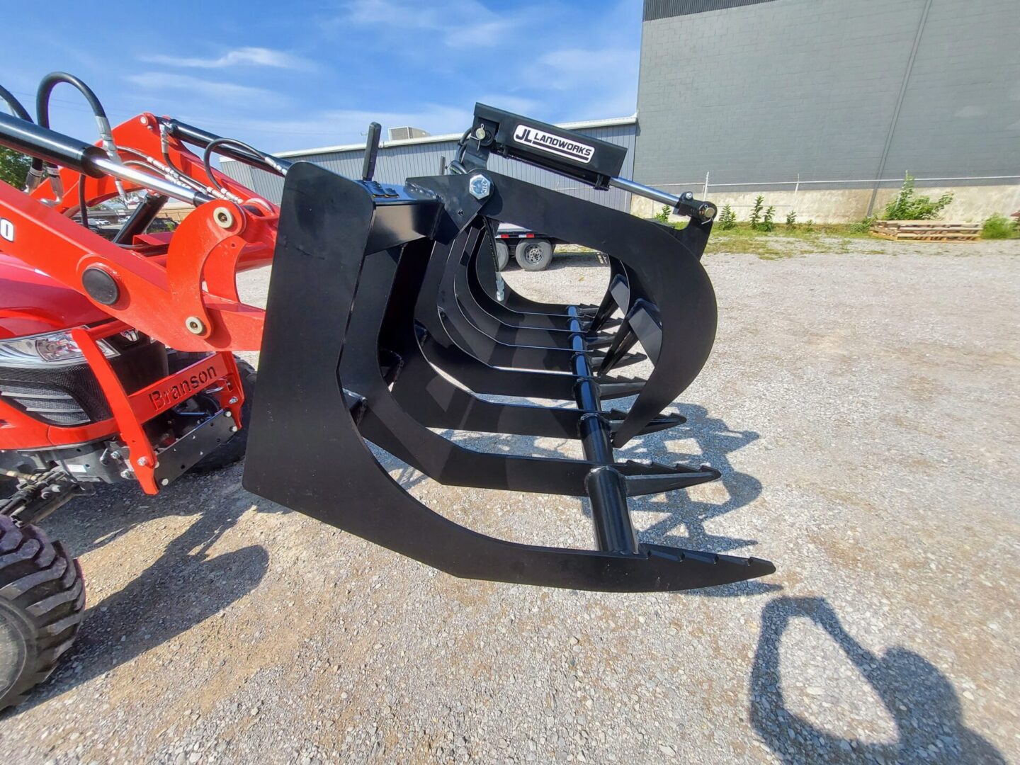 A large black metal claw on the ground.