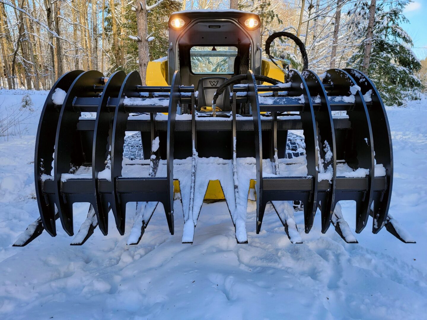 A snow plow is shown in the snow.