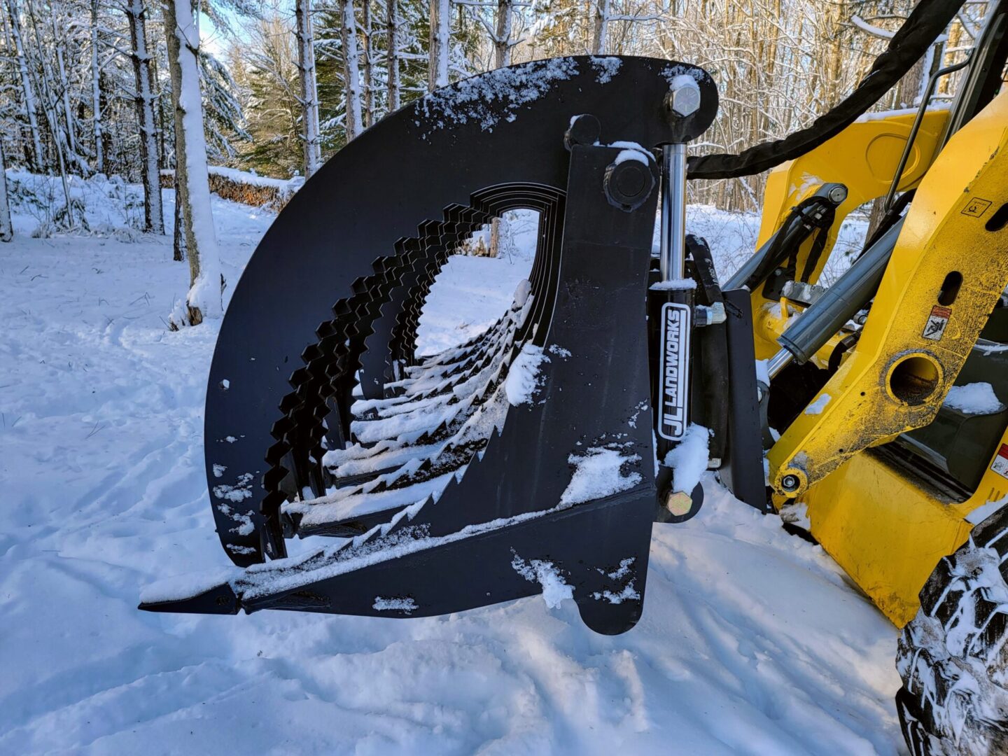 A close up of the front end of a snow plow.