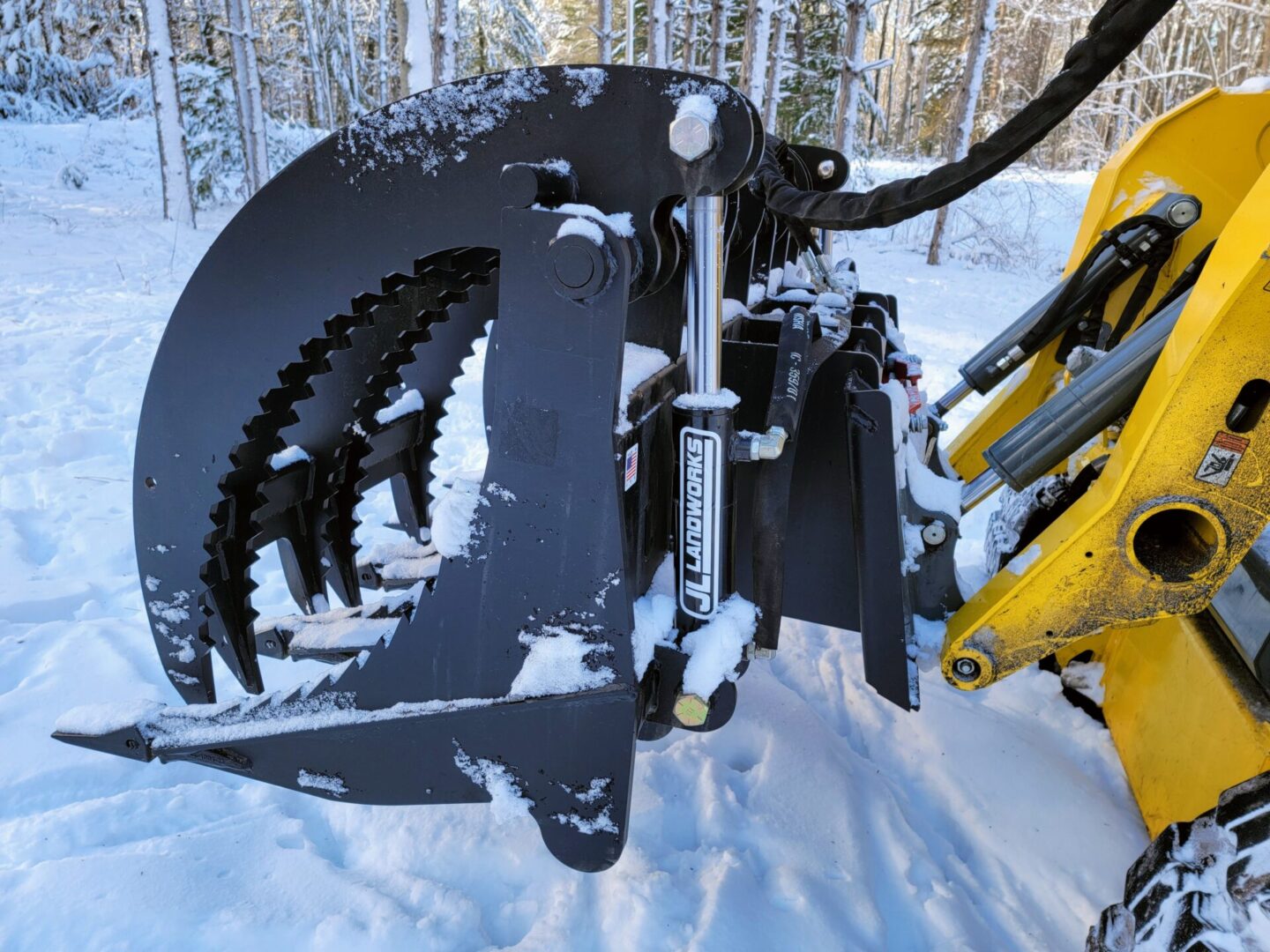 A close up of the front end of a snow plow.