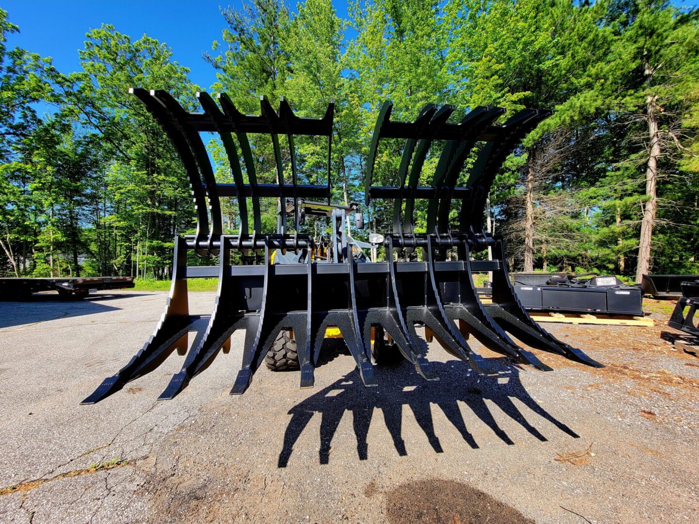 A large black metal sculpture of a tractor.