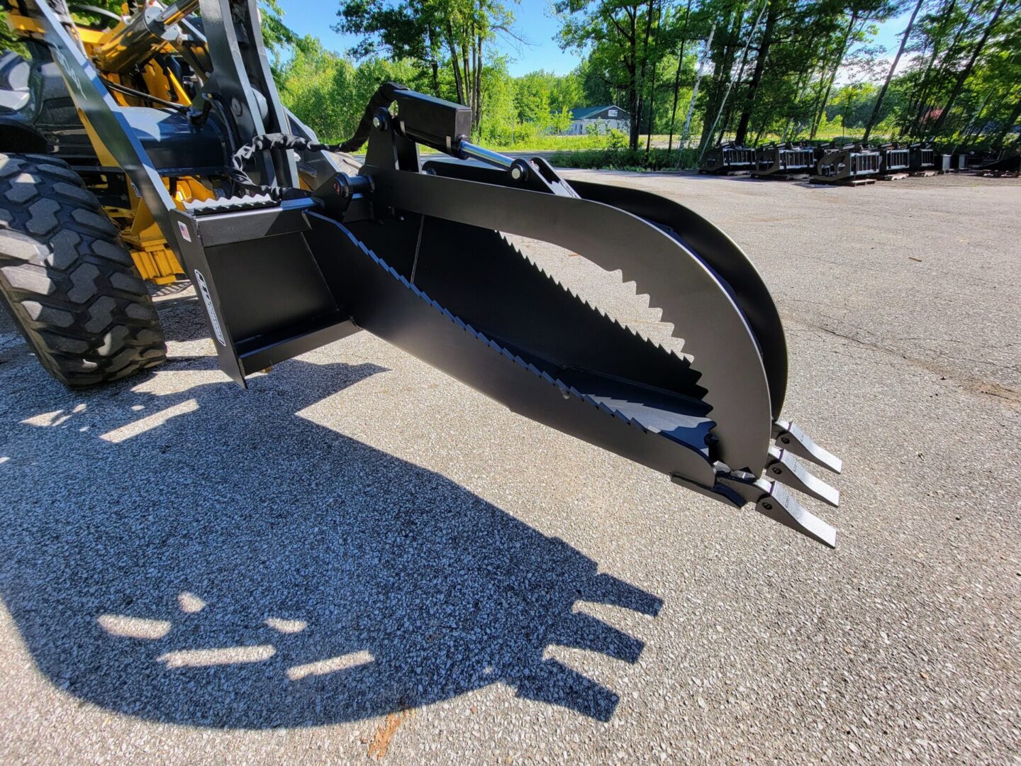 A close up of the claw on a backhoe