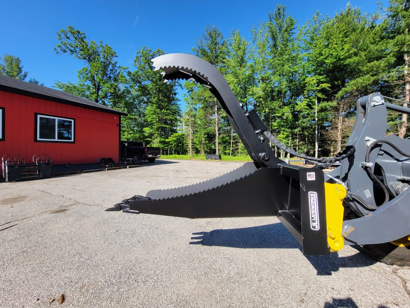 A large metal sculpture in the middle of a parking lot.