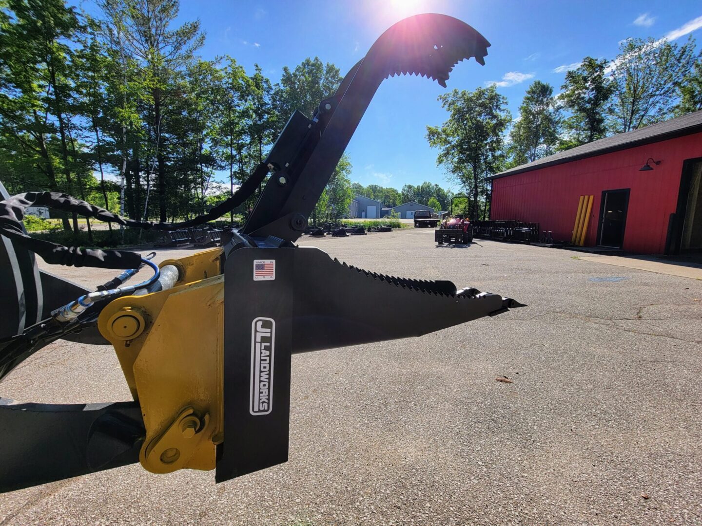 A yellow and black machine is parked in the dirt