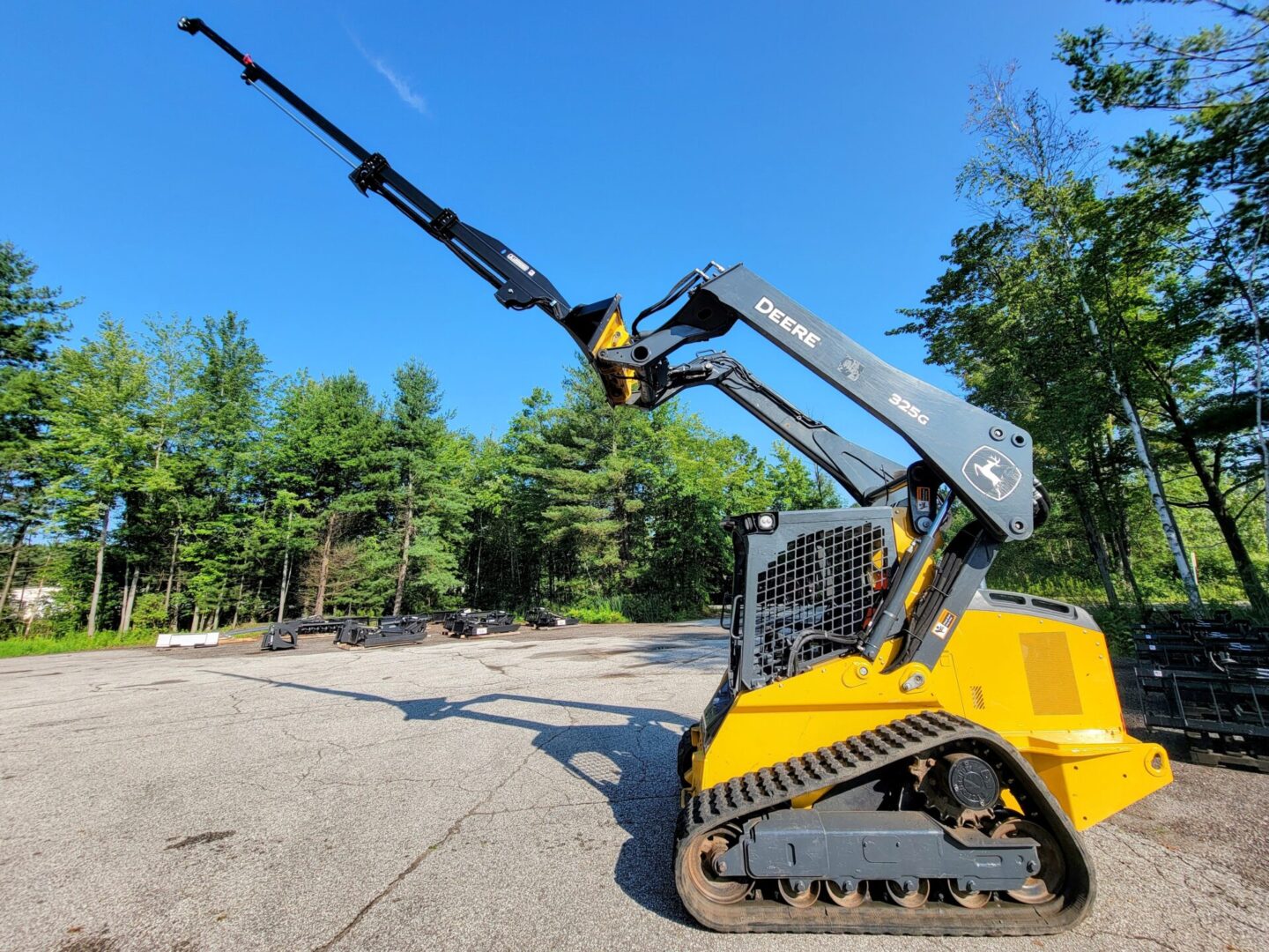 A yellow and black machine is parked in the middle of a field