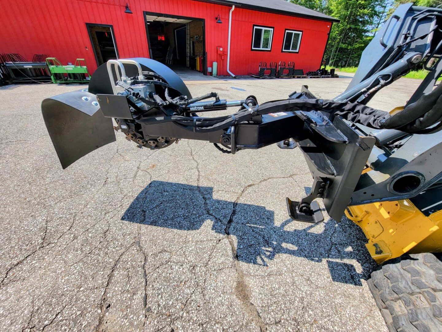 A tractor with a plow attached to it.