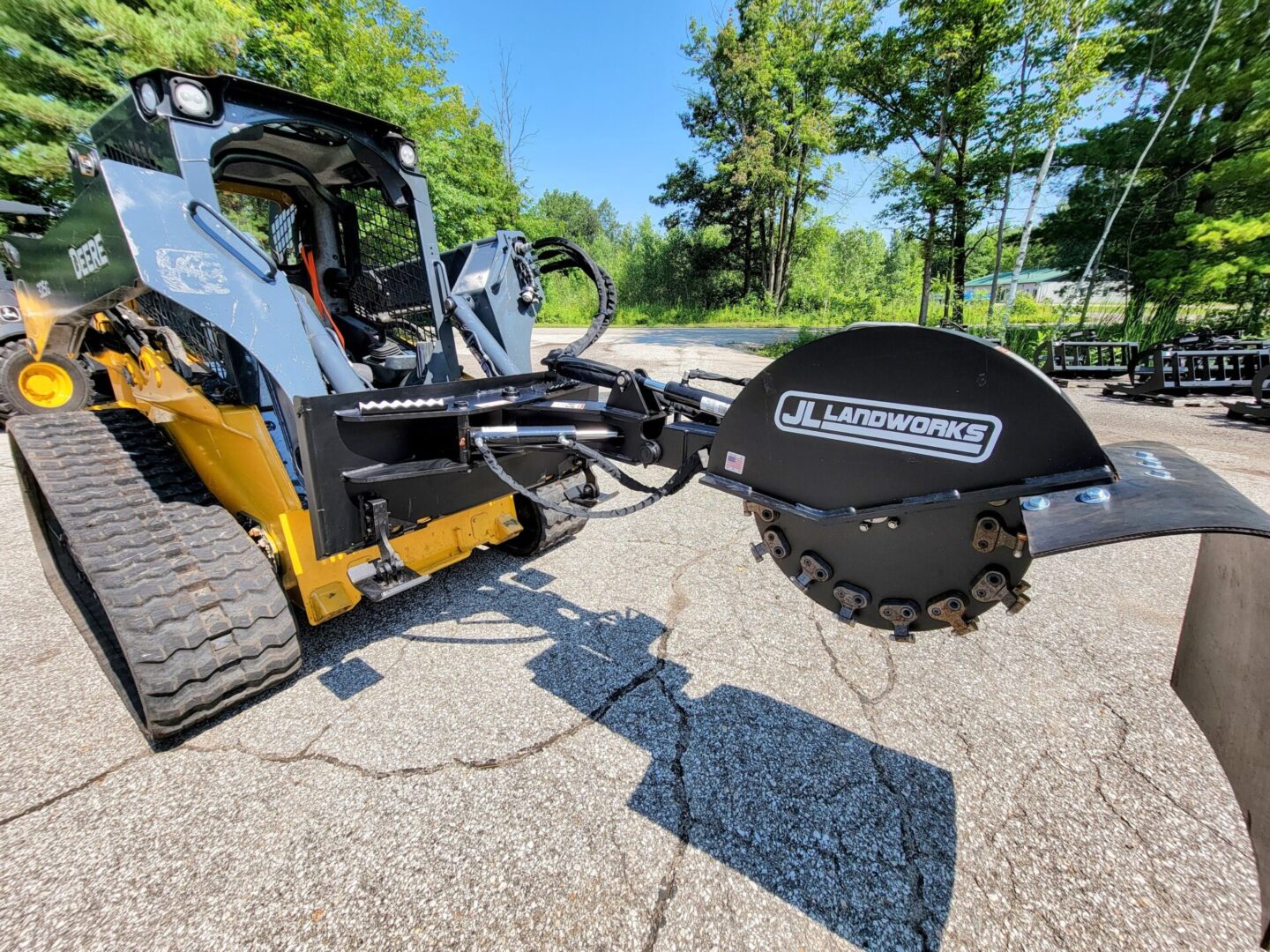 A large machine is parked on the street.