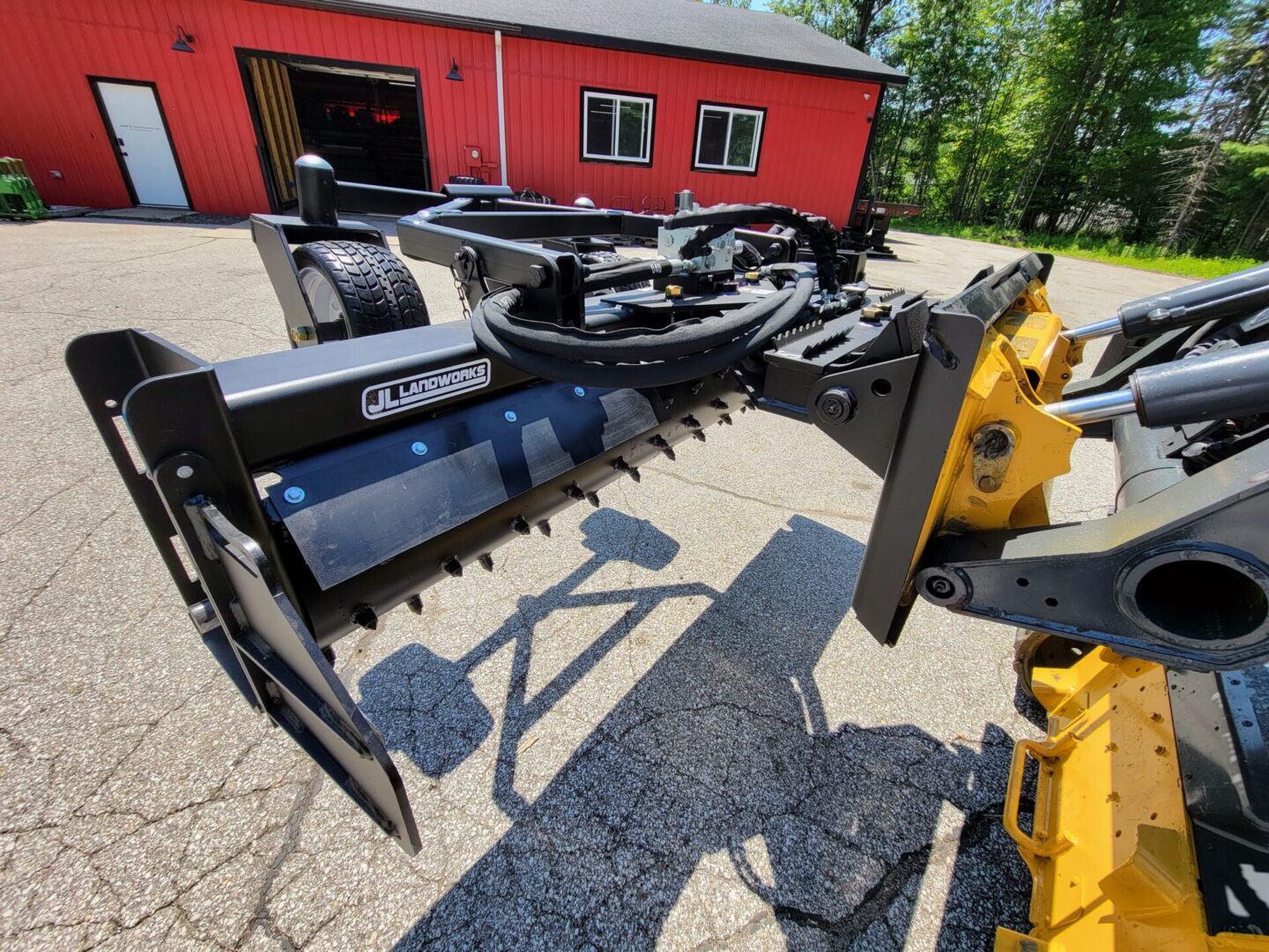 A tractor with a large plow attached to it.