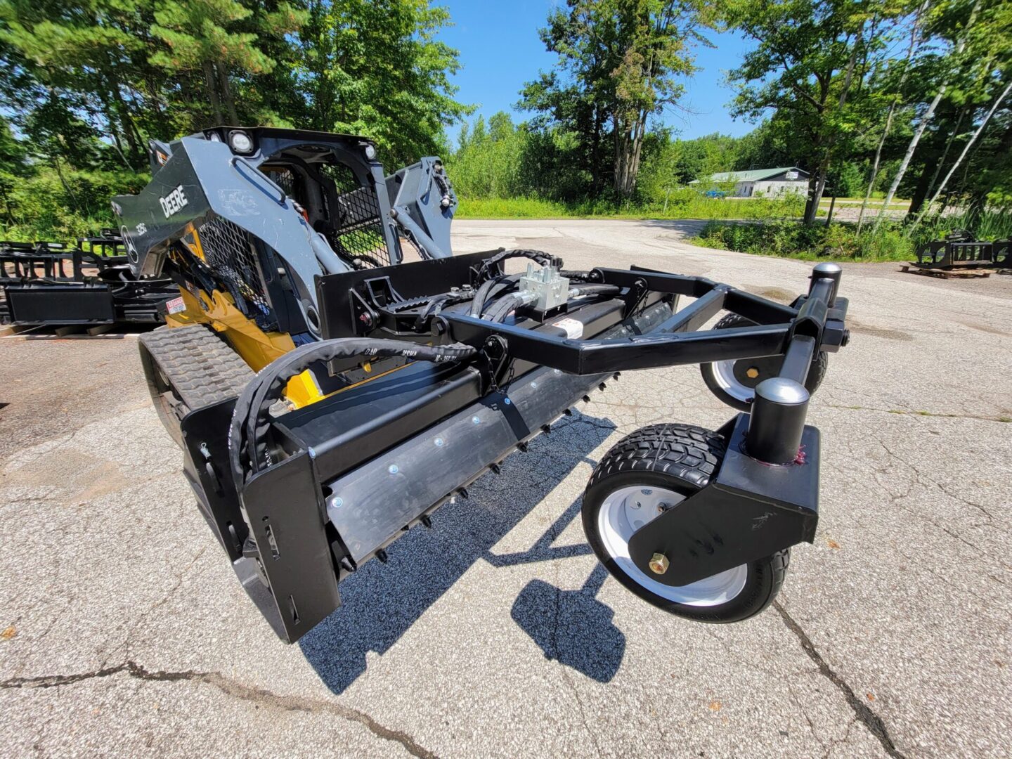 A close up of the back end of a tractor mounted mower