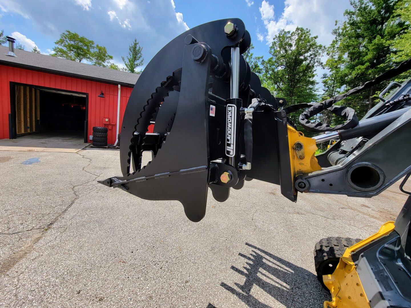 A close up of the back end of a backhoe