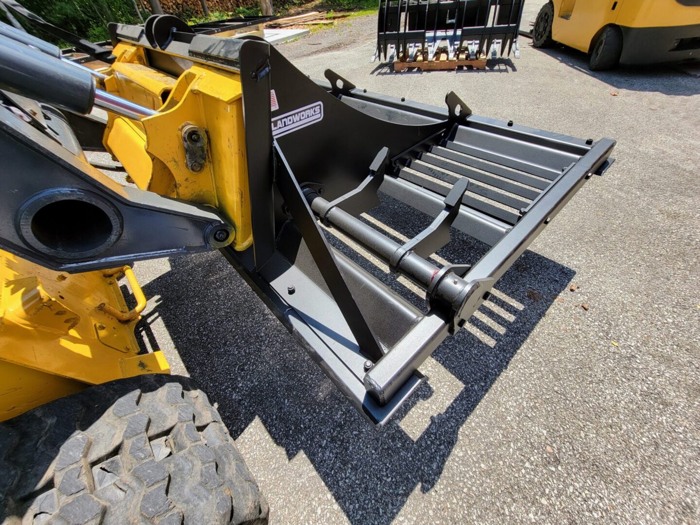 A yellow and black tractor with a metal frame.