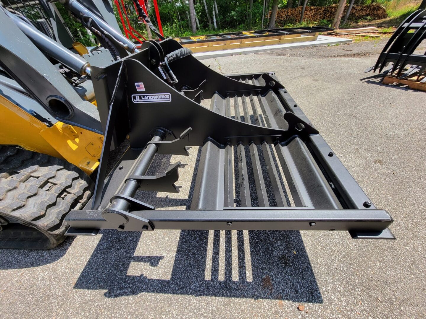 A close up of the back end of a backhoe.