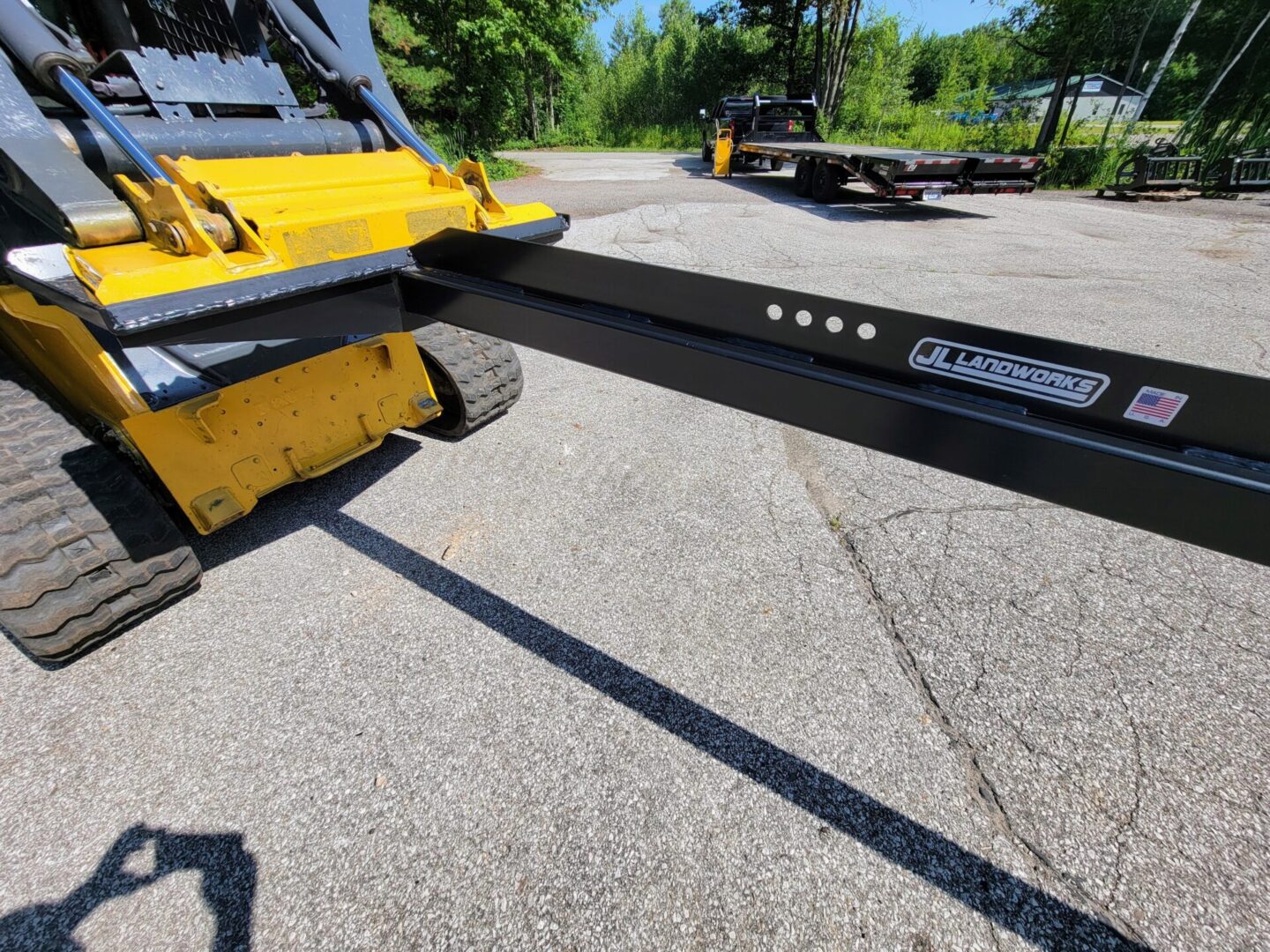 A close up of the back end of a yellow and black truck.