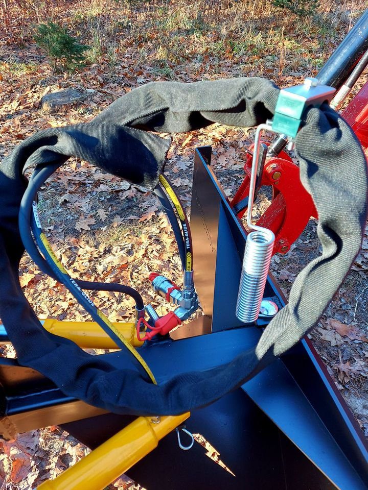 A pair of gloves and tools are on the ground.