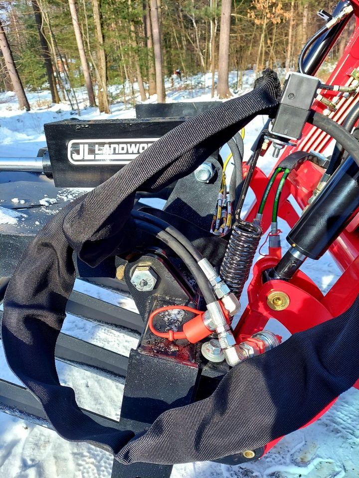 A red and black truck with some tools in it