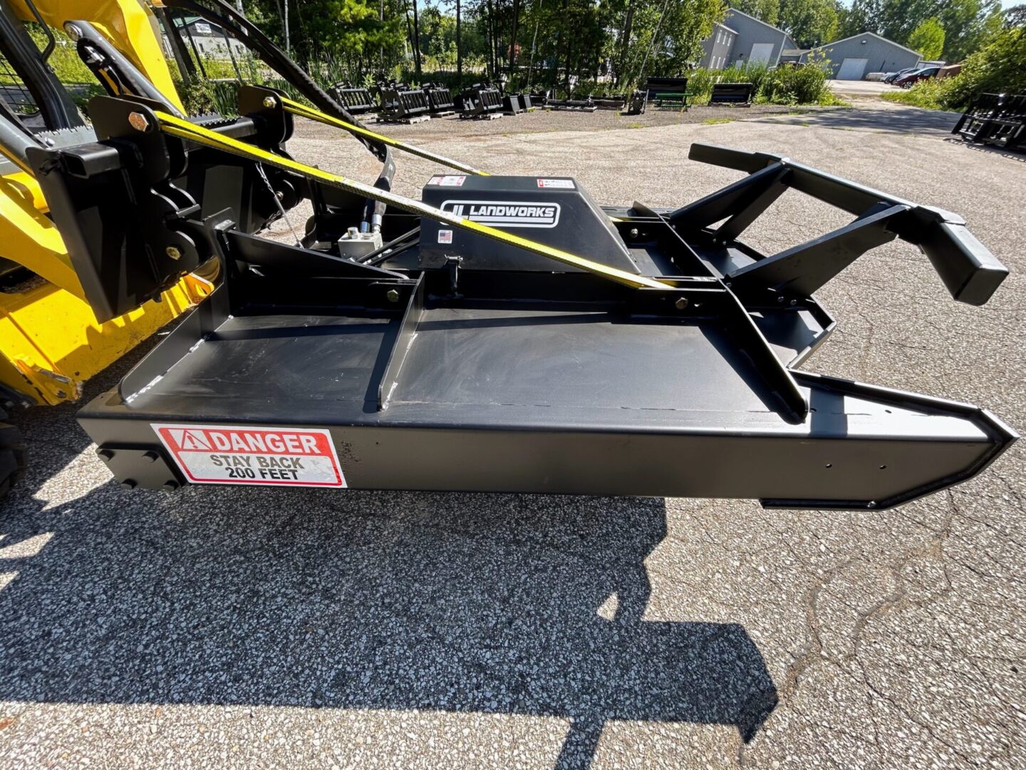 A black and yellow trailer with a large black frame.