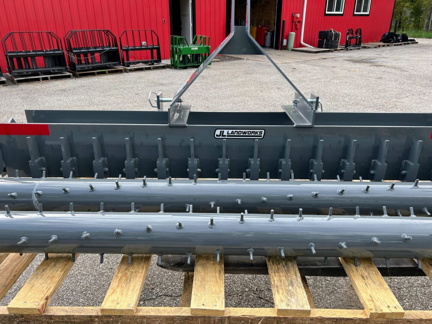 A large metal machine sitting on top of a wooden platform.