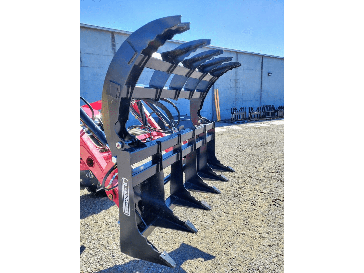 A close up of a tractor mounted plow