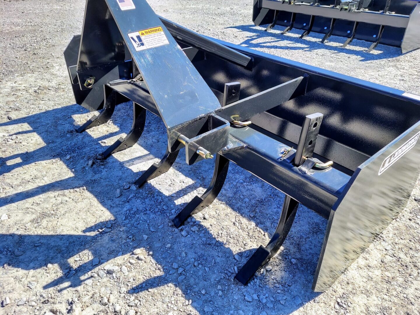 A close up of the back end of a plow