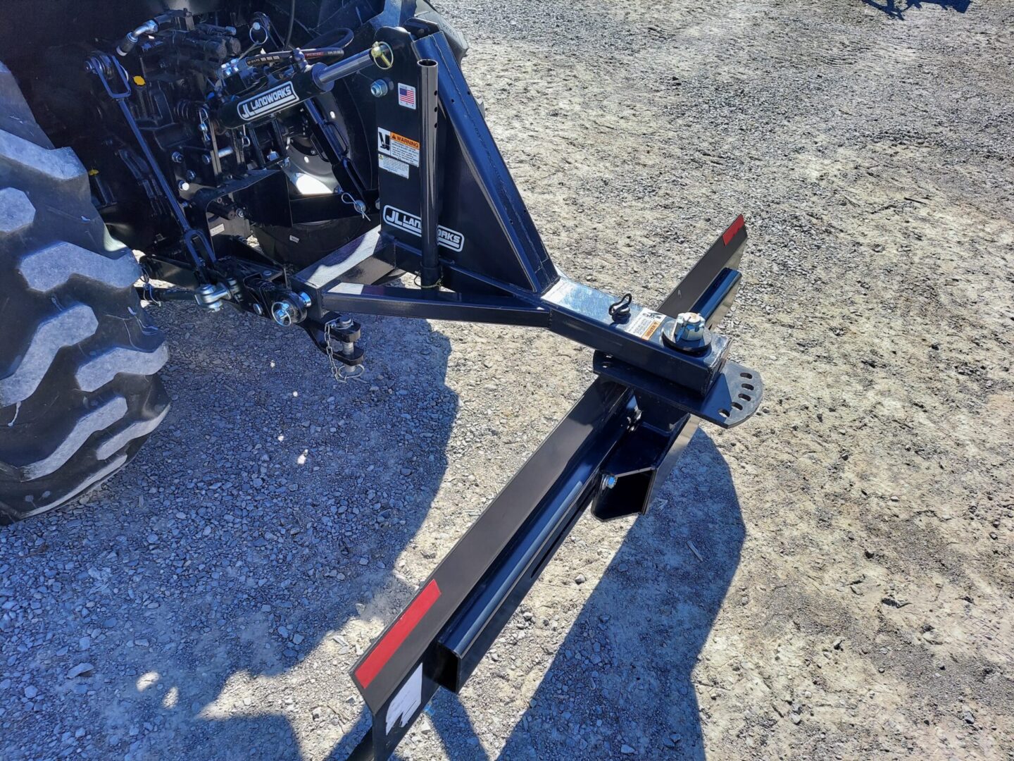 A motorcycle is parked on the ground with its license plate.