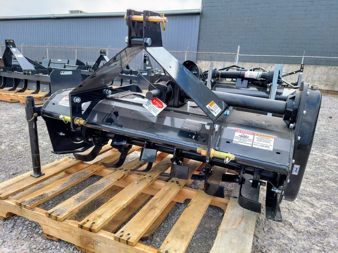 A tractor with a plow attached to it.