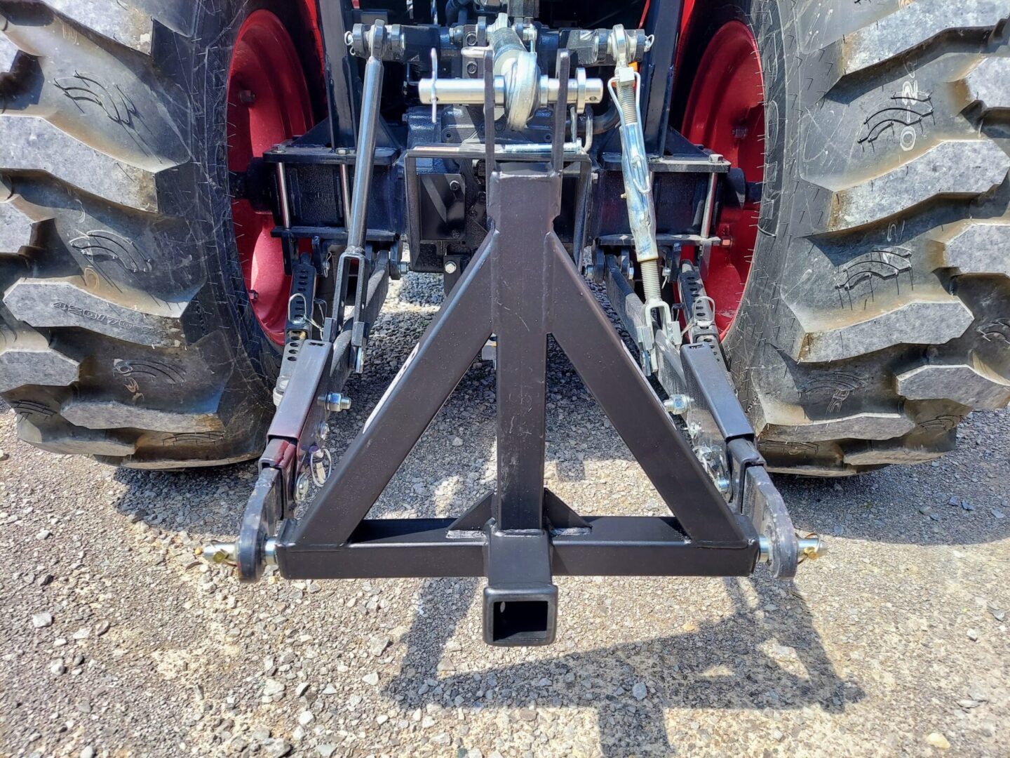 A tractor with a large trailer hitch attached to it.