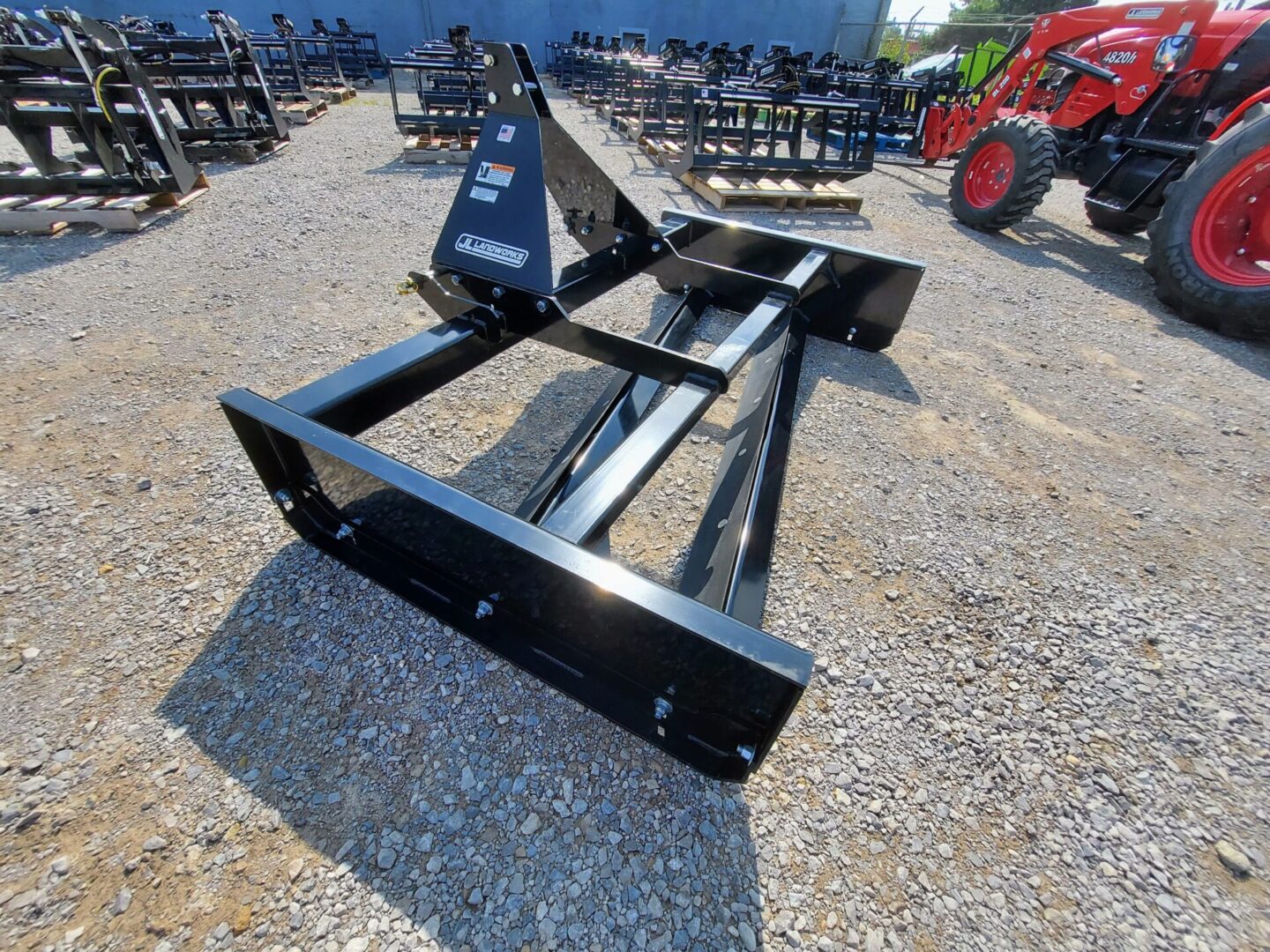 A black metal frame sitting on top of gravel.