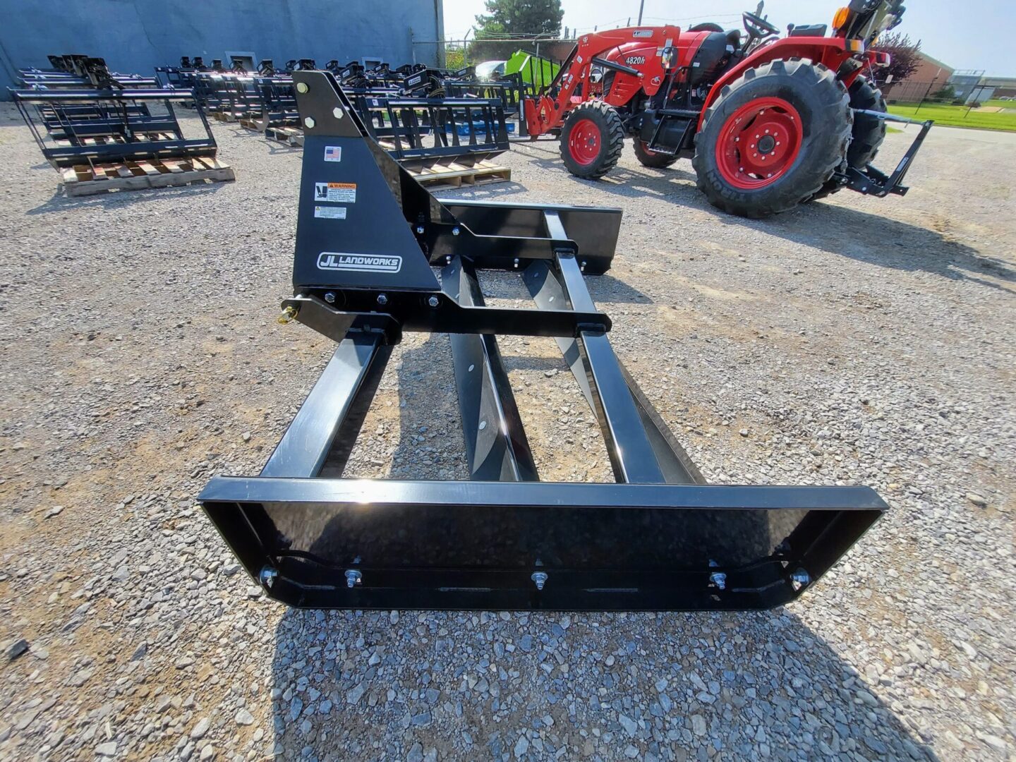 A black metal frame with a tractor on the back of it.