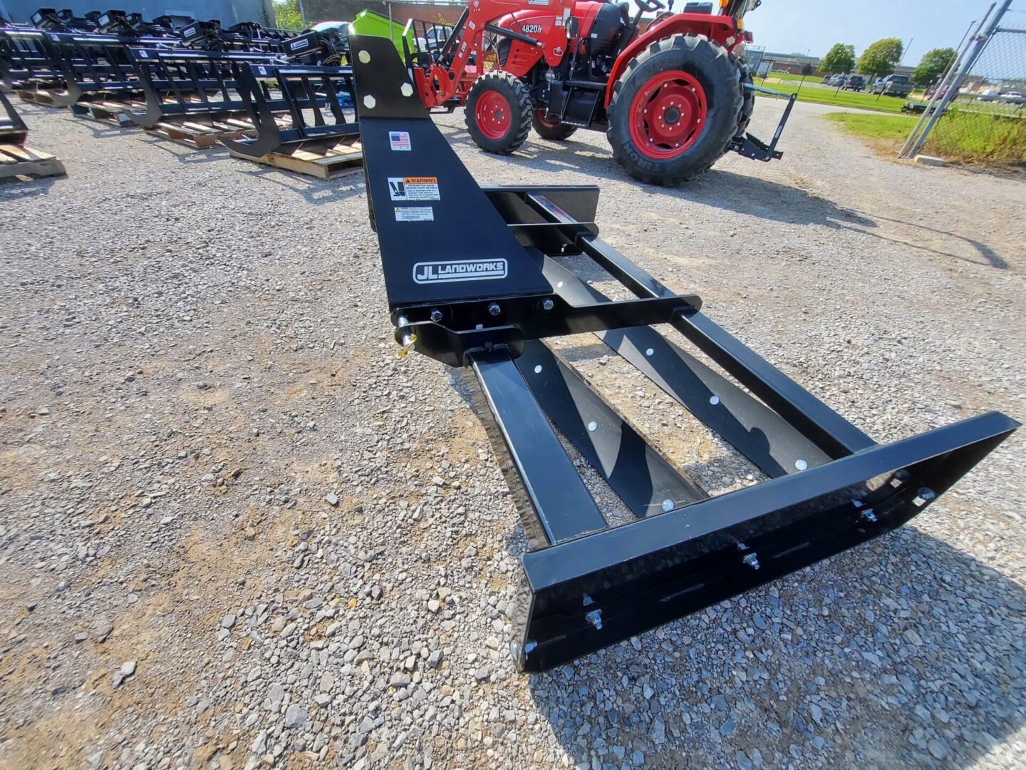 A tractor with a plow attached to it