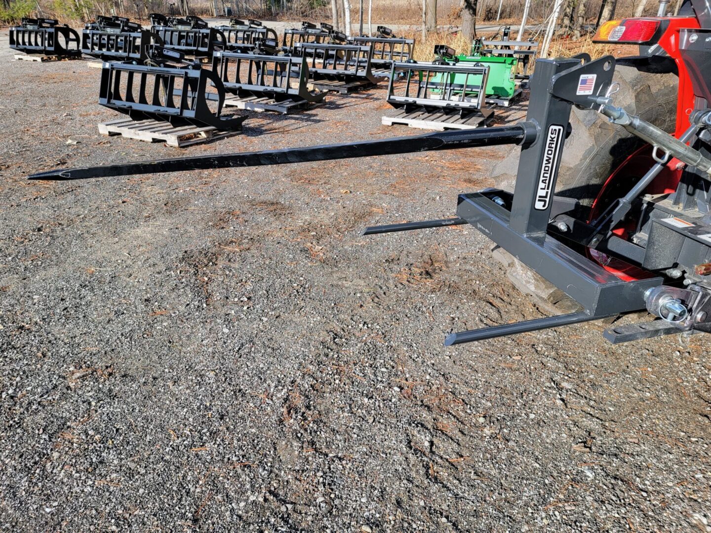 A large pile of metal chairs sitting on top of gravel.