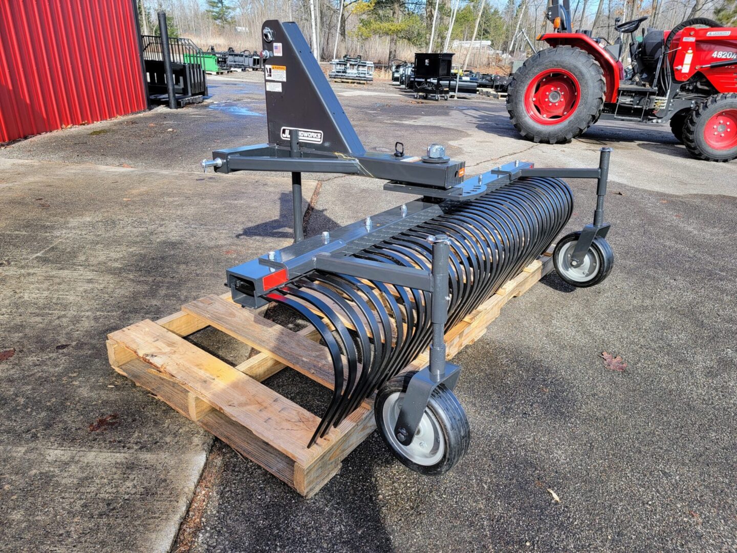 A tractor with a large metal blade on it