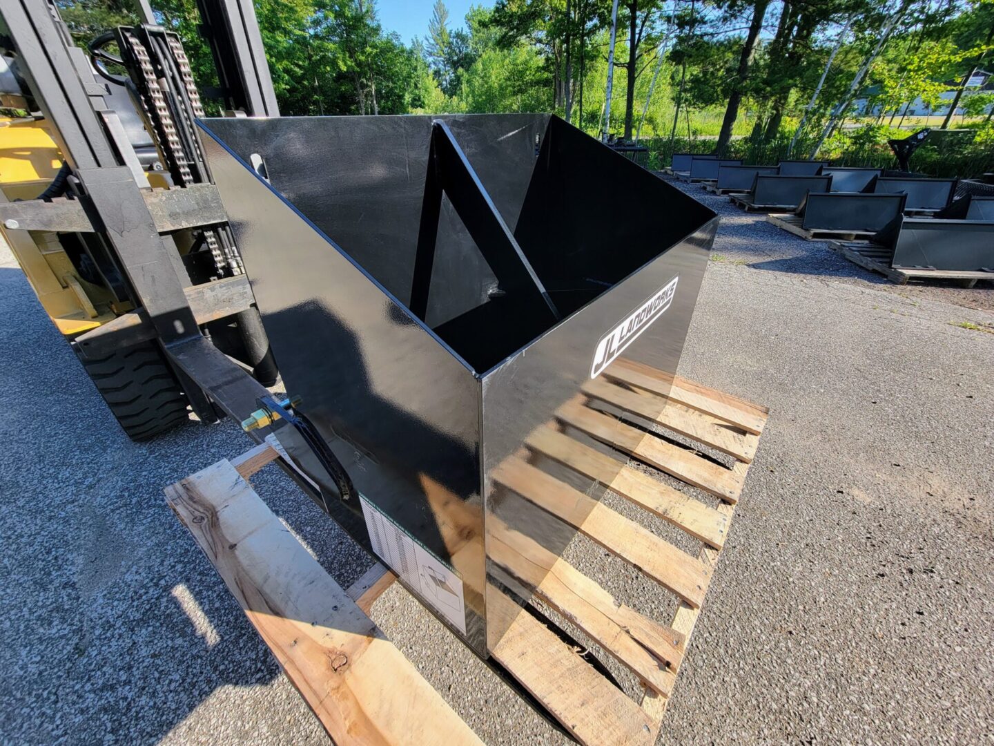 A large metal box sitting on top of a wooden pallet.